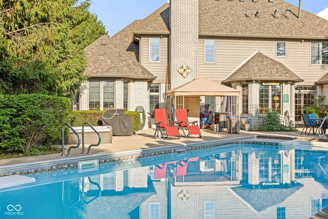2320 Whispering Way, Indianapolis, IN 46239 - community pool featuring a gazebo, a grill, and a patio area