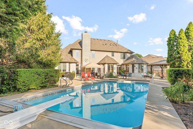 2320 Whispering Way, Indianapolis, IN 46239 - view of pool featuring a gazebo, a patio area, and a diving board