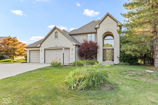 2320 Whispering Way, Indianapolis, IN 46239 - traditional-style home featuring brick siding, concrete driveway, a front yard, and an attached garage