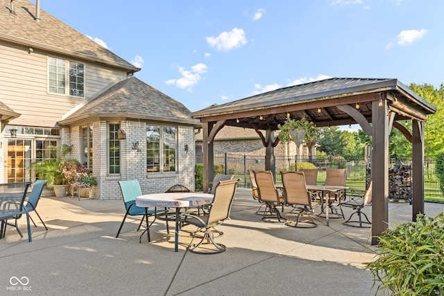 2320 Whispering Way, Indianapolis, IN 46239 - view of patio featuring a gazebo and outdoor dining area