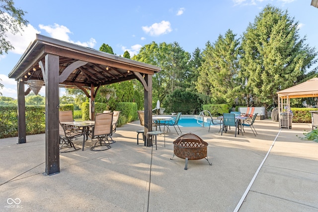 2320 Whispering Way, Indianapolis, IN 46239 - view of patio with a gazebo, outdoor dining space, and an outdoor fire pit