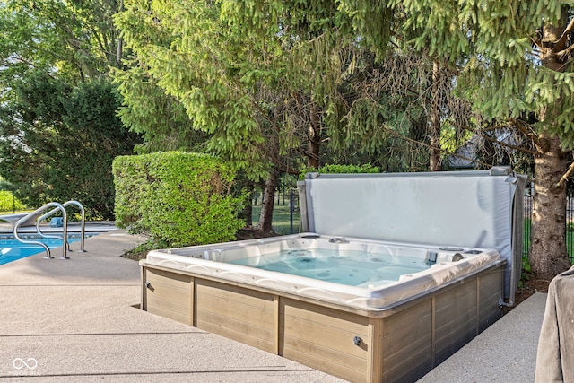 2320 Whispering Way, Indianapolis, IN 46239 - outdoor pool featuring a hot tub and a patio