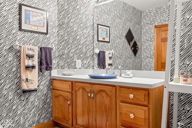 2320 Whispering Way, Indianapolis, IN 46239 - bathroom with wallpapered walls and vanity