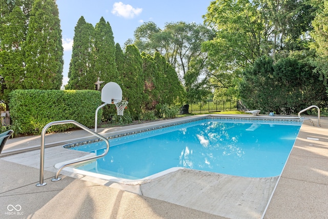 2320 Whispering Way, Indianapolis, IN 46239 - view of swimming pool featuring view of wooded area and a patio area