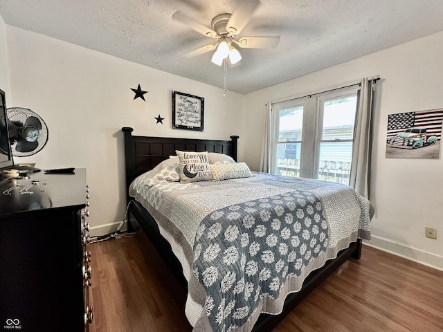329 S Lockburn St, Indianapolis, IN 46241 - bedroom featuring dark wood-style floors, ceiling fan, and a textured ceiling