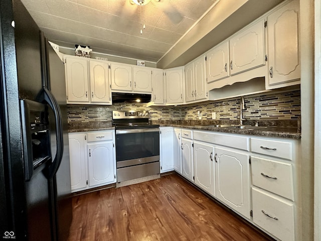 329 S Lockburn St, Indianapolis, IN 46241 - kitchen with stainless steel electric range, black fridge, under cabinet range hood, dark countertops, and dark wood-type flooring