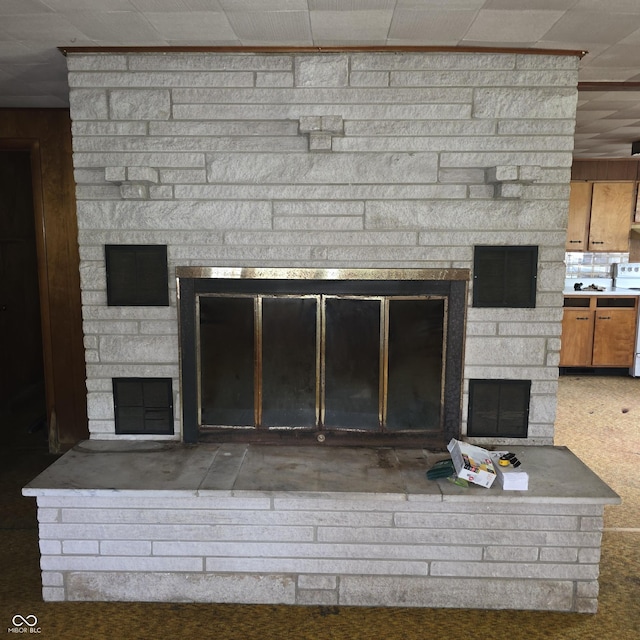 7514 E State Road 42, Poland, IN 47868 - detailed view of a stone fireplace and white electric range