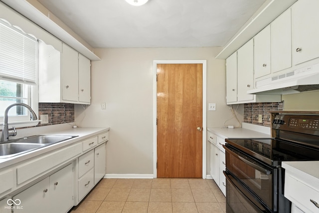3504 White River Ct, Anderson, IN 46012 - kitchen featuring range with two ovens, under cabinet range hood, tasteful backsplash, light countertops, and white cabinets