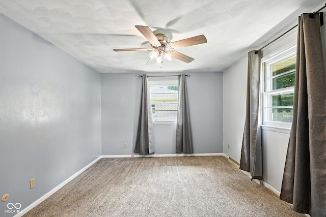 3504 White River Ct, Anderson, IN 46012 - spare room with plenty of natural light, ceiling fan, and carpet