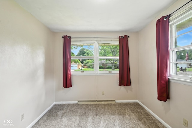 3504 White River Ct, Anderson, IN 46012 - unfurnished room featuring plenty of natural light, a baseboard radiator, and carpet flooring