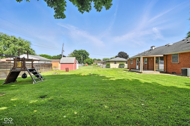 3504 White River Ct, Anderson, IN 46012 - fenced backyard featuring a playground and a patio