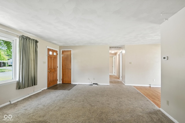 3504 White River Ct, Anderson, IN 46012 - carpeted spare room with a baseboard heating unit and baseboards