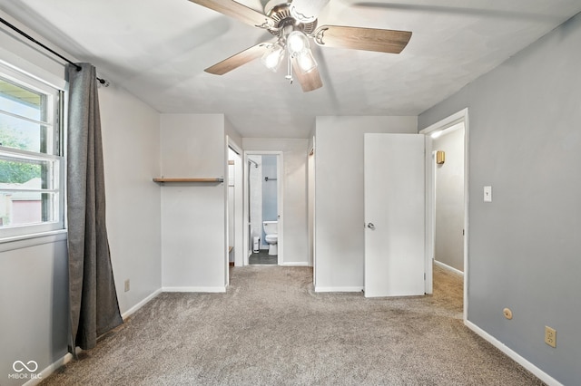 3504 White River Ct, Anderson, IN 46012 - unfurnished bedroom with carpet flooring, ensuite bathroom, and a ceiling fan