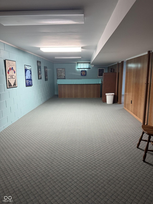 4032 Roselawn Ave, Columbus, IN 47203 - finished below grade area with carpet flooring, bar, concrete block wall, and wood walls