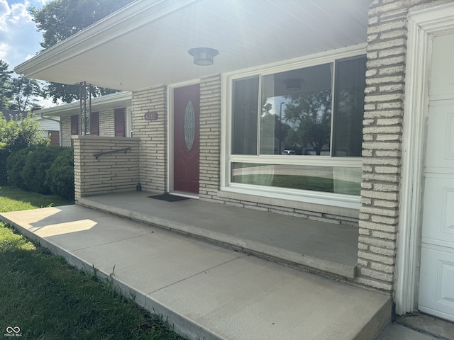 4032 Roselawn Ave, Columbus, IN 47203 - doorway to property featuring brick siding and covered porch