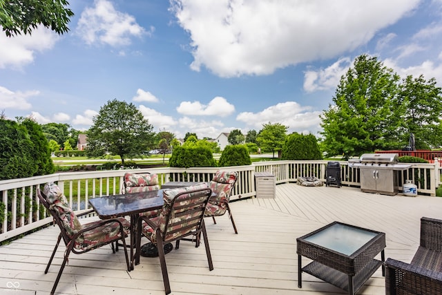 13390 Grosbeak Ct, Carmel, IN 46033 - wooden terrace with outdoor dining area and view of wooded area