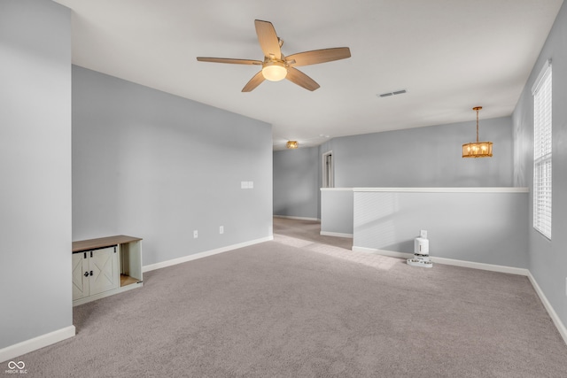 5353 Hibiscus Dr, Plainfield, IN 46168 - carpeted spare room with a ceiling fan and a chandelier