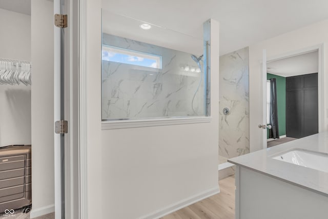 5353 Hibiscus Dr, Plainfield, IN 46168 - bathroom with a marble finish shower, vanity, wood finished floors, and recessed lighting