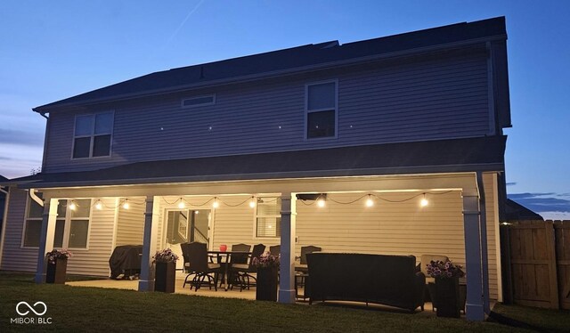5353 Hibiscus Dr, Plainfield, IN 46168 - back of house at dusk featuring a patio area
