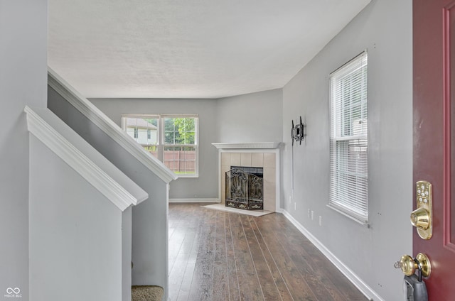 5541 Lippan Way, Indianapolis, IN 46221 - unfurnished living room with a fireplace, hardwood / wood-style flooring, and stairs