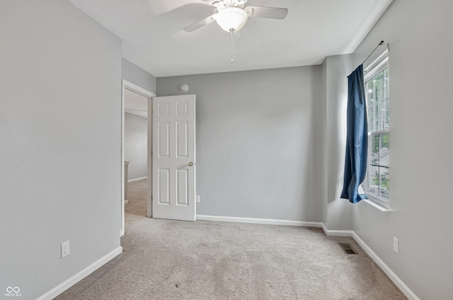 5541 Lippan Way, Indianapolis, IN 46221 - unfurnished bedroom with carpet flooring and a ceiling fan