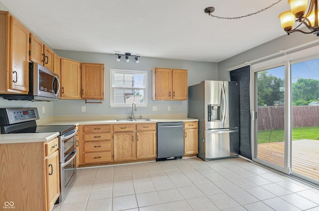 5541 Lippan Way, Indianapolis, IN 46221 - kitchen featuring stainless steel appliances, plenty of natural light, light countertops, and light tile patterned floors