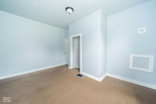 2627 Chase St, Anderson, IN 46016 - empty room with light wood-style flooring and baseboards