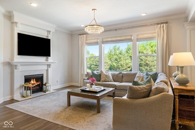 2566 Maple Creek Dr, Westfield, IN 46074 - living area featuring dark wood-type flooring, a premium fireplace, ornamental molding, recessed lighting, and a chandelier