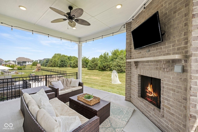 2566 Maple Creek Dr, Westfield, IN 46074 - view of patio / terrace with an outdoor living space with a fireplace and a ceiling fan