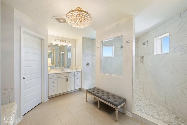 2566 Maple Creek Dr, Westfield, IN 46074 - bathroom with a chandelier, walk in shower, vanity, and healthy amount of natural light