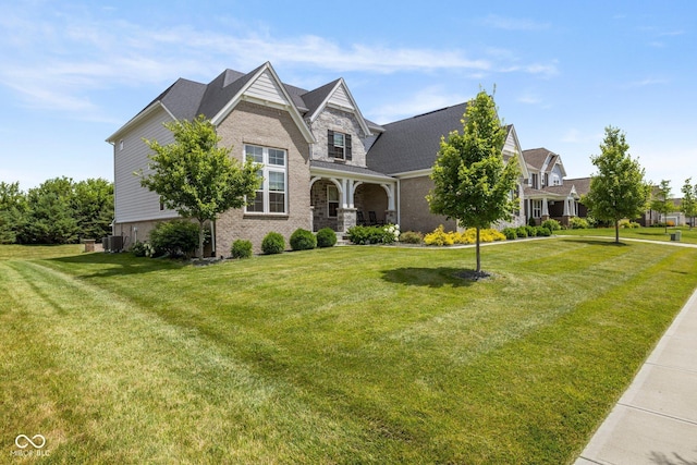 2566 Maple Creek Dr, Westfield, IN 46074 - view of front of house featuring a front lawn, brick siding, and covered porch