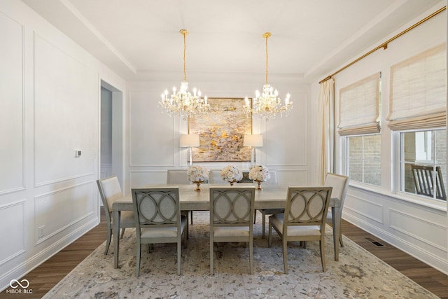 2566 Maple Creek Dr, Westfield, IN 46074 - dining area with a decorative wall, a chandelier, and dark wood-type flooring