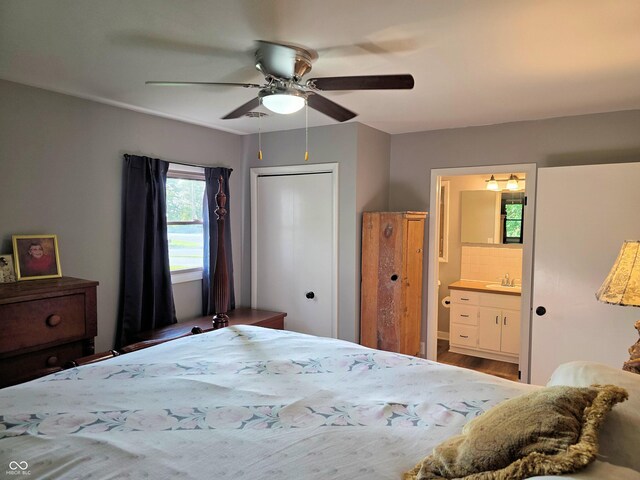 3303 N 850 E, Columbus, IN 47203 - bedroom featuring ensuite bath, ceiling fan, and wood finished floors