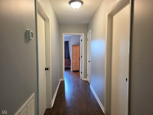 3303 N 850 E, Columbus, IN 47203 - corridor featuring dark wood finished floors and baseboards