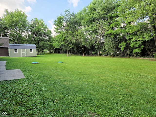 3303 N 850 E, Columbus, IN 47203 - view of yard with an outbuilding and view of wooded area
