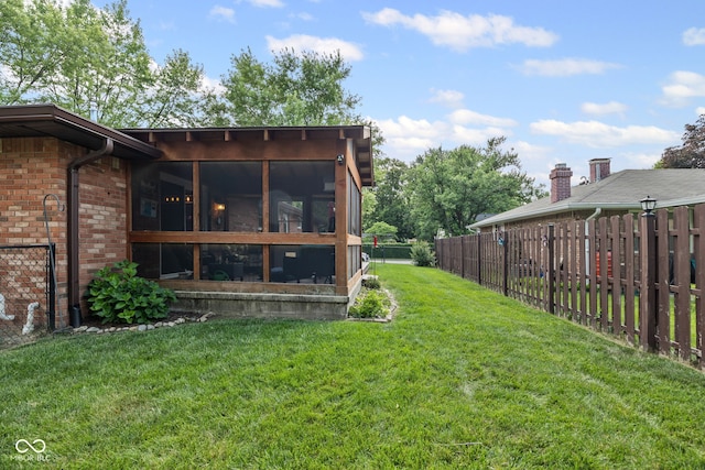 624 Cumberland Ave, West Lafayette, IN 47906 - fenced backyard with a sunroom