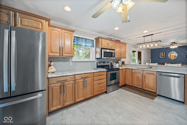 624 Cumberland Ave, West Lafayette, IN 47906 - kitchen with stainless steel appliances, a ceiling fan, ornamental molding, light stone countertops, and decorative light fixtures