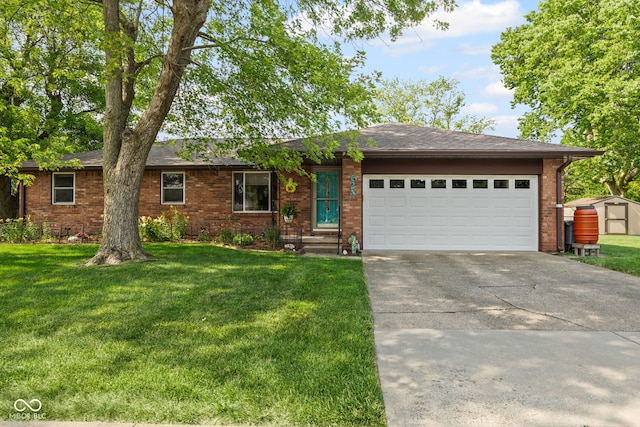 624 Cumberland Ave, West Lafayette, IN 47906 - ranch-style house with driveway, a garage, a front yard, brick siding, and a storage shed