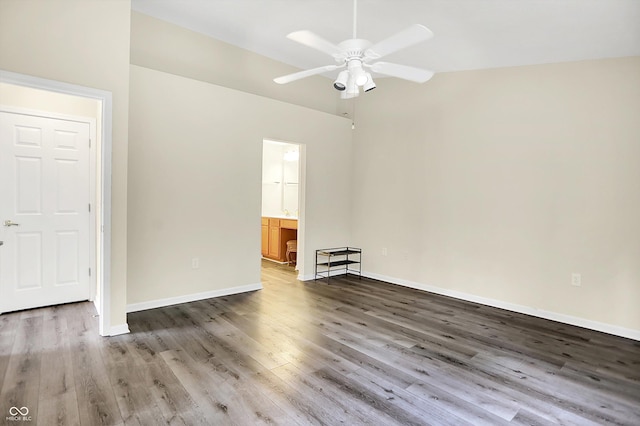 549 Dylan Dr, Avon, IN 46123 - spare room with a ceiling fan, lofted ceiling, and wood finished floors
