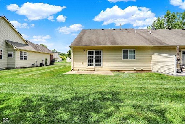 549 Dylan Dr, Avon, IN 46123 - back of house with a patio, a lawn, and roof with shingles