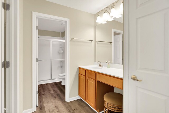 549 Dylan Dr, Avon, IN 46123 - full bathroom with wood finished floors, a shower stall, and vanity
