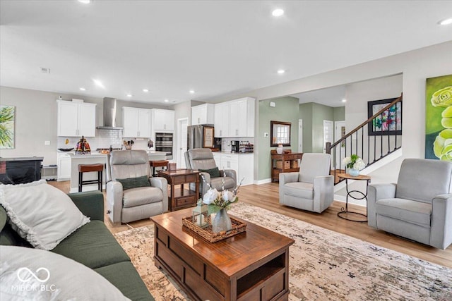 5345 Ridgecrest Ln, Mccordsville, IN 46055 - living area with light wood finished floors, stairway, and recessed lighting