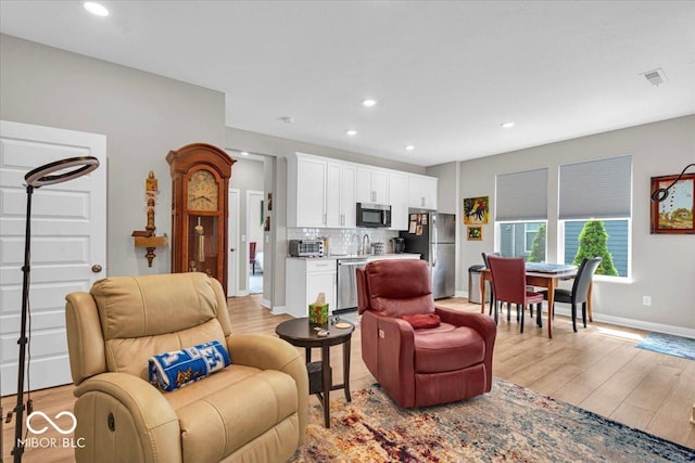 5345 Ridgecrest Ln, Mccordsville, IN 46055 - living area with light wood-type flooring and recessed lighting
