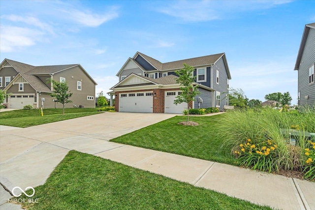 5345 Ridgecrest Ln, Mccordsville, IN 46055 - craftsman inspired home with driveway, a front lawn, an attached garage, and brick siding