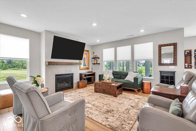5345 Ridgecrest Ln, Mccordsville, IN 46055 - living room with wood finished floors, a tile fireplace, and recessed lighting