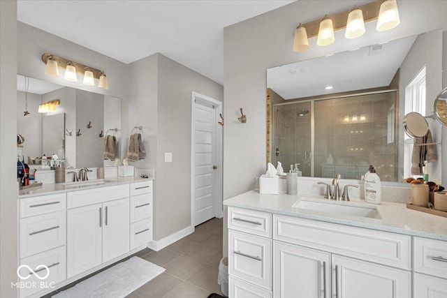 5345 Ridgecrest Ln, Mccordsville, IN 46055 - full bathroom featuring a stall shower, two vanities, and tile patterned flooring