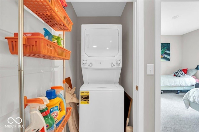 5345 Ridgecrest Ln, Mccordsville, IN 46055 - laundry room with stacked washer and clothes dryer and carpet