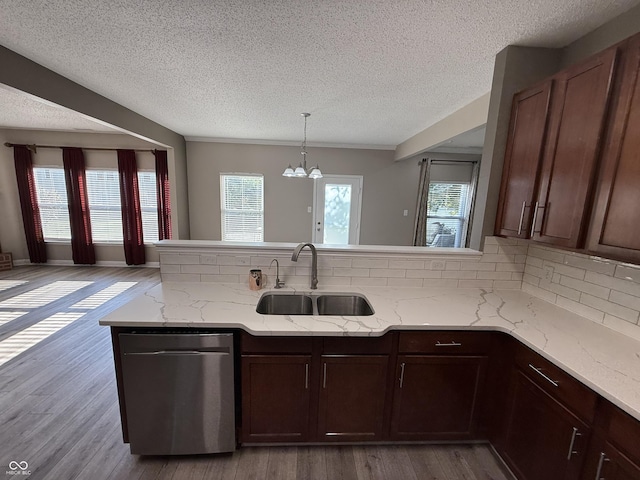 14171 Refreshing Garden Ln, Fishers, IN 46038 - kitchen with stainless steel dishwasher, a textured ceiling, backsplash, and plenty of natural light