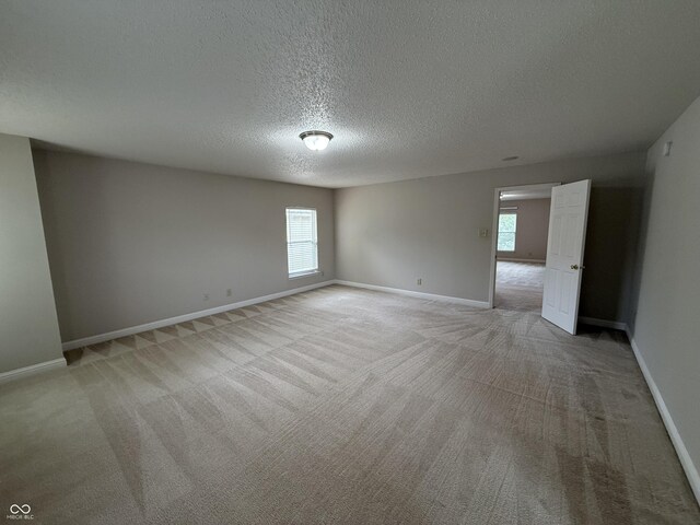 14171 Refreshing Garden Ln, Fishers, IN 46038 - unfurnished room with light colored carpet and a textured ceiling