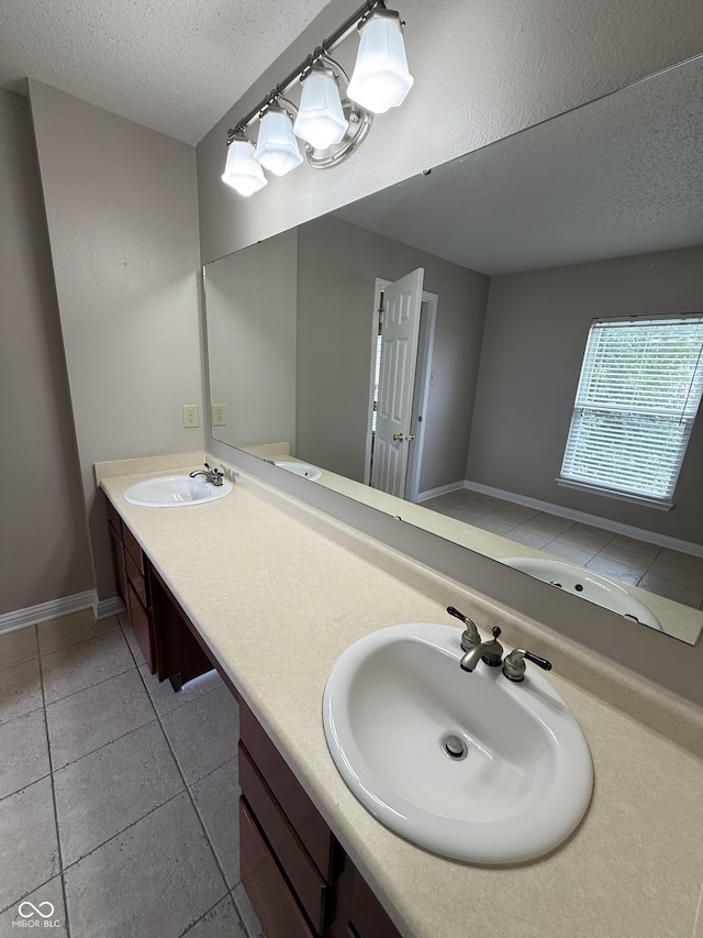 14171 Refreshing Garden Ln, Fishers, IN 46038 - full bath featuring a textured ceiling, double vanity, and tile patterned floors
